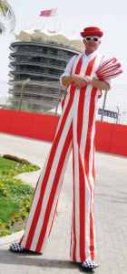 Circus-themed stilt walkers for hire. Our walkabout entertainers are available to book for summer events in London & the UK.