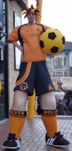 professional stilt walkers for hire. Book football walkabout acts for your event in the UK.