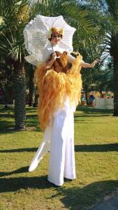 Golden Harvest Fairies for hire. Book our Fairy stilt walkers for eco-themed events in London & the UK.