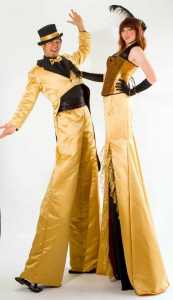 The Golden Stilt Walkers for hire. Our Golden Stilt Walkers are available to book for corporate events, shopping centre events or picnic events in London & the UK.