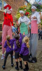 Crazy cook stilt walkers for hire. Book our Gourmet Chef stilt walkers for food festivals in the UK & London.