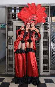 French Cabaret themed stilt walkers for hire. Our themed stilt walkers are available to book for shopping centre events in London & the UK.