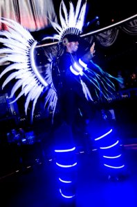 Glow Quetz for hire. Book our sci-fi themed stilt walkers for corporate events in London & the UK.
