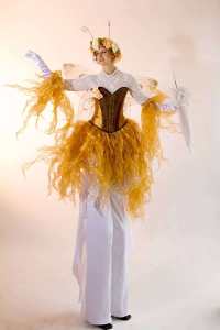 Golden fairy stilt walkers for hire. Book our Golden Harvest Fairies for picnic events in the UK & London.