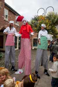 Gourmet Chef stilt walkers for hire. Our chef stilt walkers are available to book for family fun days in London & the UK.