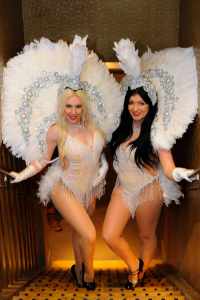 White Feathered Showgirls for hire. Book our dancers for corporate events in London & the UK.