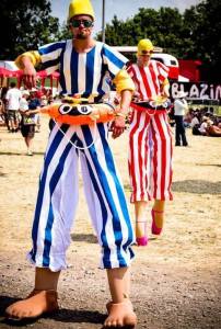Dipping Dynamo stilt walkers for hire. Book our summer-themed stilt walkers for family fun days in London & the UK.