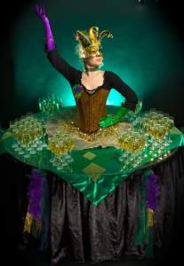 Carnival Living Champagne Table for hire. Book our masquerade-themed human table for Mardi Gras-themed events, masquerade-themed events or corporate events in London & the UK.