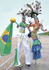 Rio-themed Stilt Walkers for hire. Our Rio-themed walkabout act is available to book for family fun days, Olympics-themed events or public events in London & the UK.