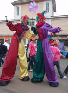 Clown stilt walkers for hire. Our Crazy Clown stilt walkers are available to book for shopping centre events in the UK & London.