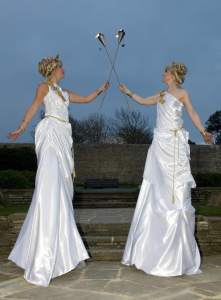 Olympics Torch Bearer Stilt Walkers for hire. Our Olympics-themed stilt walkers are available to book for sports-themed events in London & the UK.