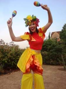 Summer & Carnival-themed Stilt Walkers for hire. Our carnival walkabout acts are available to book for family fun days, music festivals or summer fetes in London & the UK.