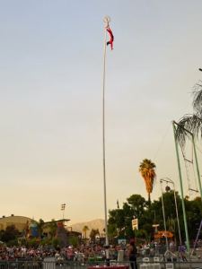 Giant Sway Poles for hire. Book our Sway Pole acrobats for summer festivals in London & the UK.