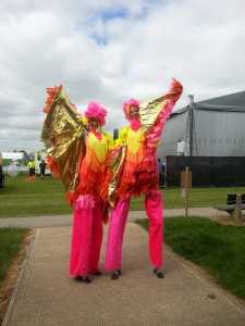 Birds of Paradise Stilt Walkers for hire. Our carnival walkabout acts are available to book for summer-themed events in London & the UK.