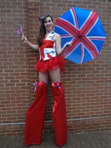 British flag stilt walker for hire. Our British-themed entertainers are available to book for family fun days in London & the UK.