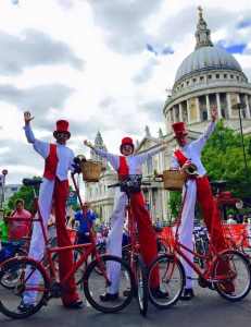 Cycling Stilt Walkers for hire. Our comedy cyclist stilt walkers are available to book for Easter events in London & the UK.