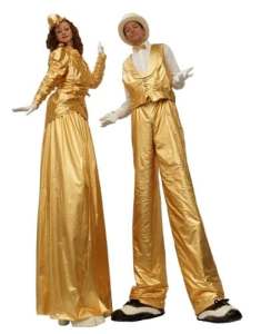 Gold stilt walking duo for hire. Our stilt walkers are available to hire for themed events in London & the UK.