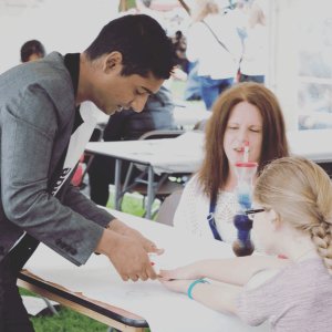 Abz the close-up magician performing at a public event in the UK.