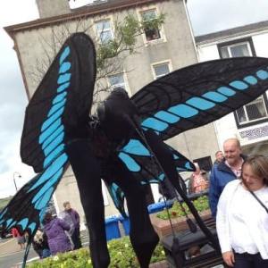 Butterly Stilt Walkers for hire. Our animal-themed walkabout act is available to book for family fun days in the UK & London.