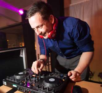 Professional DJ performing at an event in the UK. We have a wide range of DJs available for hire in London and across the UK.