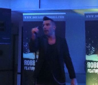 Robbie Williams Lookalike for hire. Book our musical tribute act for music festivals in the UK & London.