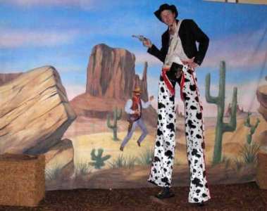 Cowboy Stilt Walker for hire. Our wild west-themed entertainment is available to book for family fun days, carnivals, summer festivals or corporate events in London & the UK.