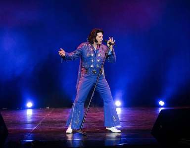 Elvis Presley lookalike for hire in London & the UK. Elvis Presley tribute act performing on stage.