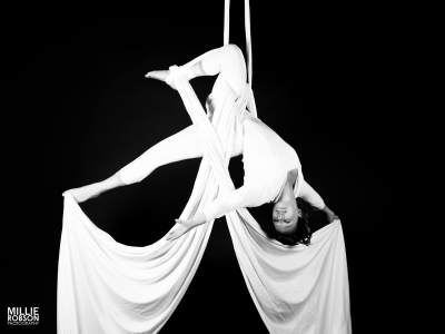 Cirque-style aerial silk performer available to book for corporate events in the UK.