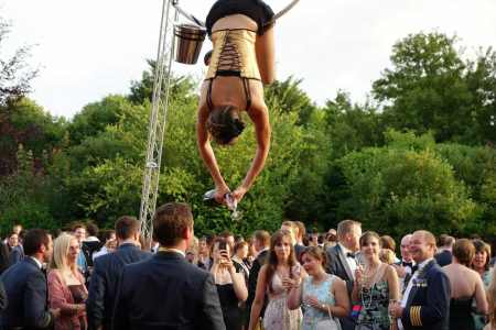 Aerial Champagne Bartenders for hire. Book our aerial acts for corporate events in London & the UK.