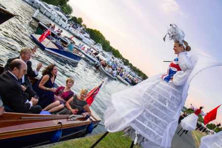 Flag-waving stilt walkers for hire. Our British Beauty Stilt Walkers are available to book for picnic events in London & the UK.