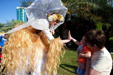 Golden Harvest Fairies for hire. Book our golden fairy stilt walkers for shopping centre events in the UK & London.