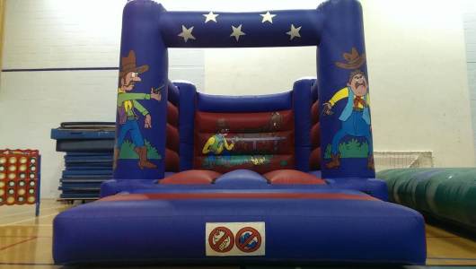 Cowboy Bouncy Castle for hire. Our bouncy castle is available to book for family fun days in London & the UK.