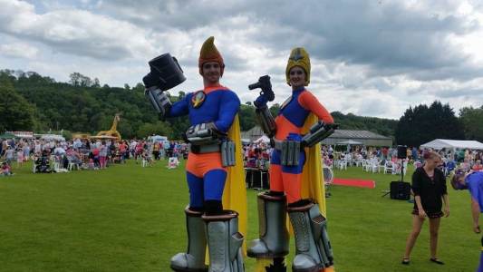 UK-based stilt walking artists for hire for family fun day events.