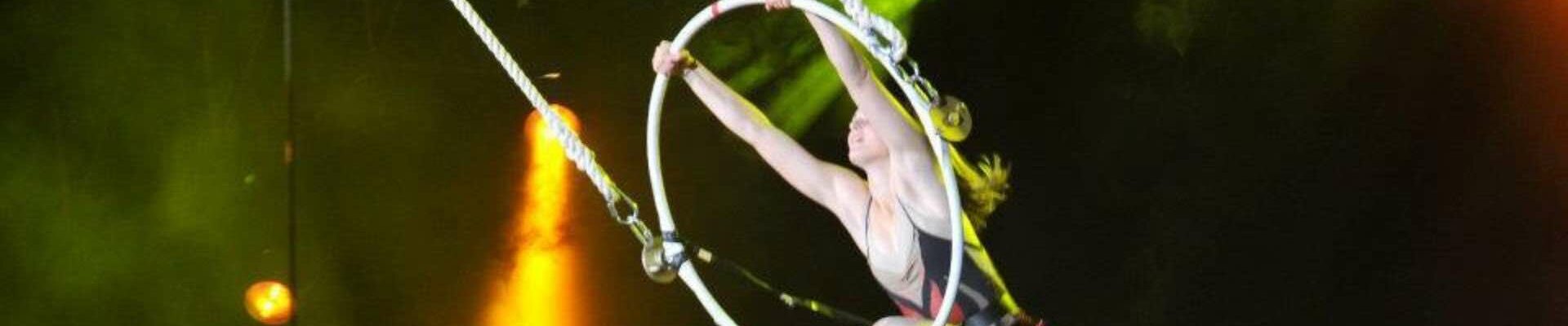 Aerialist-Performing-In-Front-Of-Projections Aerialist-Performing-In-Front-Of-Projections