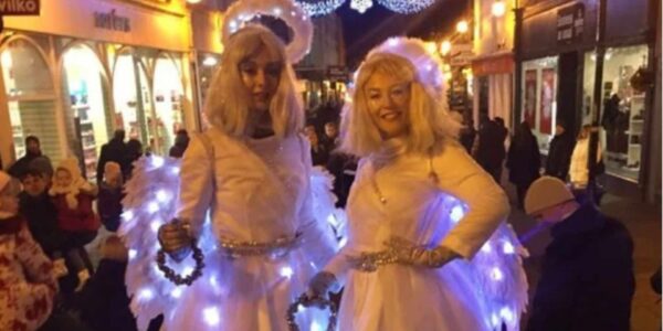 Angel-Stilt-Walkers-In-Parade