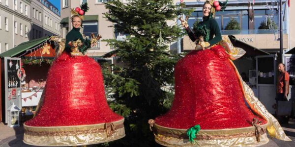 Stilt-Performers-Dressed-As-Bells