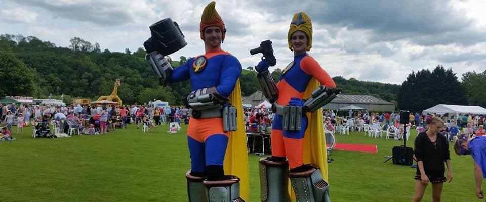 UK-based stilt walking artists for hire for family fun day events.