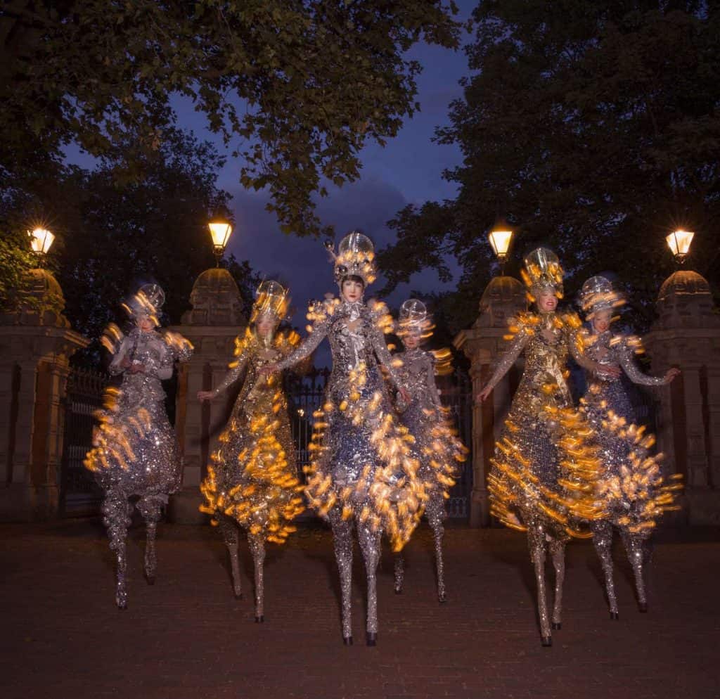 Winter Wonderland-themed stilt walkers for hire. Book our Glitter Ball Stilt Walkers for Christmas-themed events in London & the UK.
