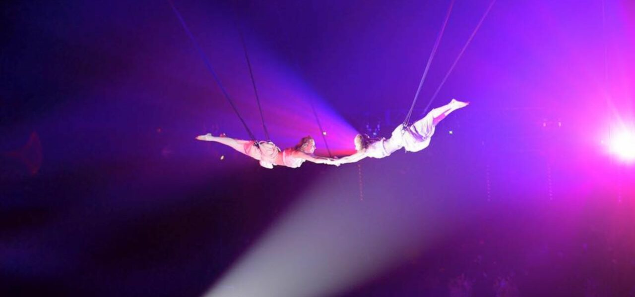 Acrobats-Hold-Hands-Mid-Air