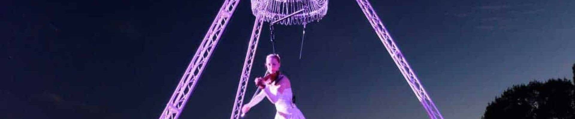 Aerial-Violinist-Hanging-From-Chandelier Aerial-Violinist-Hanging-From-Chandelier