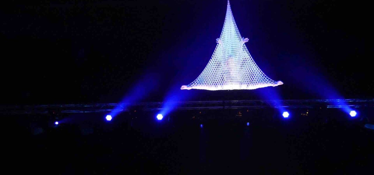 Aerialist-Hangs-From-Net