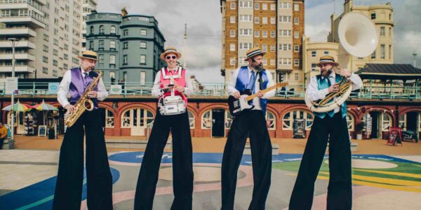 Band-On-Stilts-In-Colourful-Jackets
