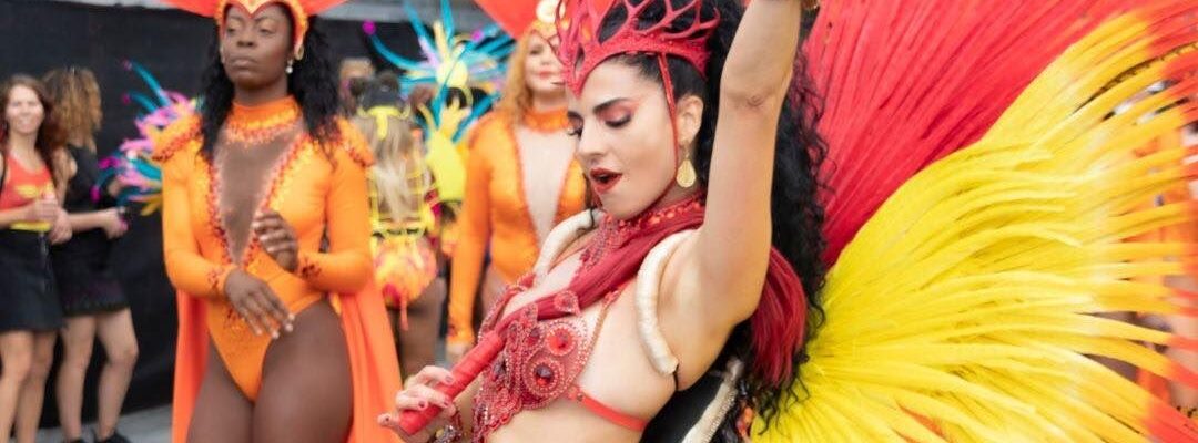 Carnival-Dancer-Performing-In-Red-And-Yellow-Outfit Carnival-Dancer-Performing-In-Red-And-Yellow-Outfit