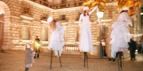 Christmas-Stilt-Walkers-Interacting-With-Public