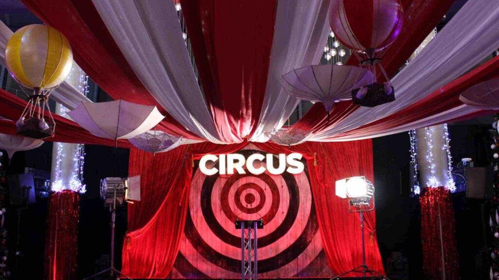 Draping and lighting details for a circus themed event