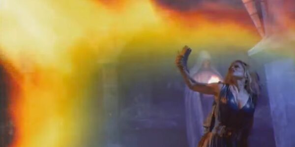 Dancer-Shielding-From-Projected-Fire