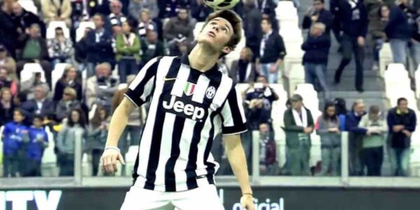 Football-Performer-Balances-Football-On-Head