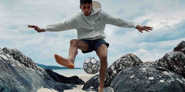 Freestyling-Football-Player-On-Beach