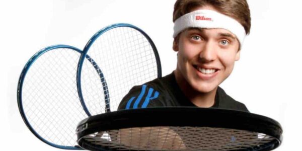Juggler-Holding-Tennis-Racket