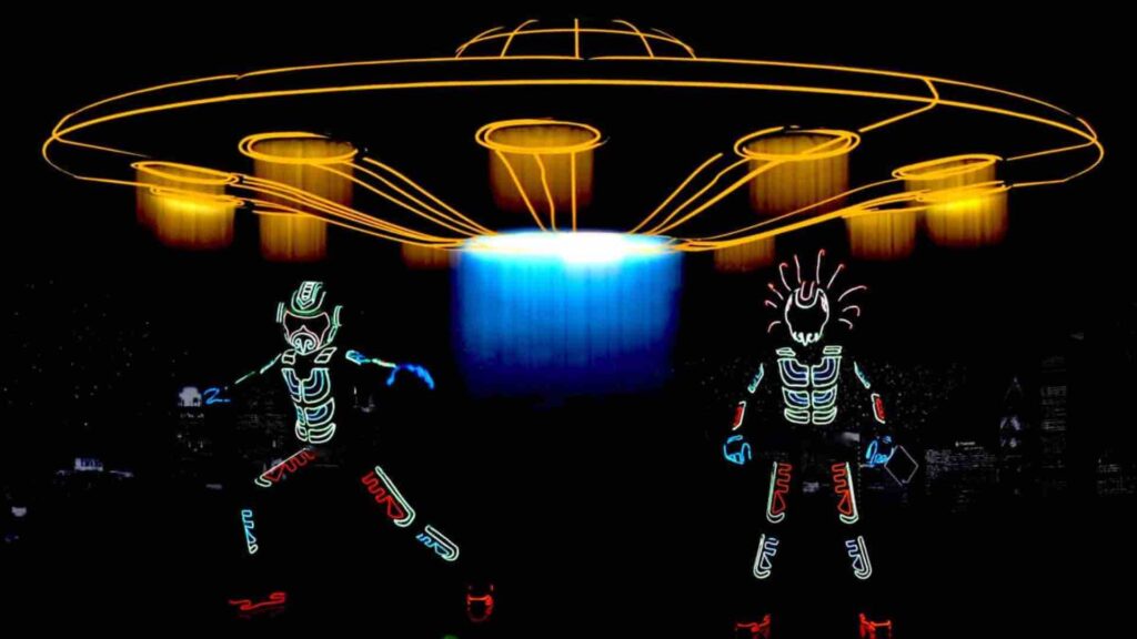 Two LED Performers stand in front of LED UFO